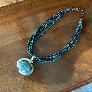 Jade(?) beaded necklace and silver tone pendant with jade(?)